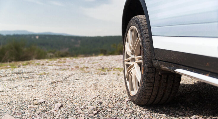 transport-driving-motor-vehicle-concept-close-up-dirty-car-wheel-cliff