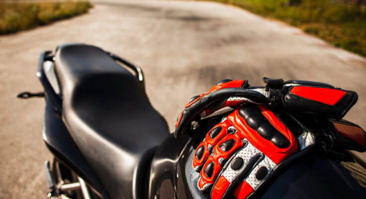 Black Motorbike With Riding Red Gloves