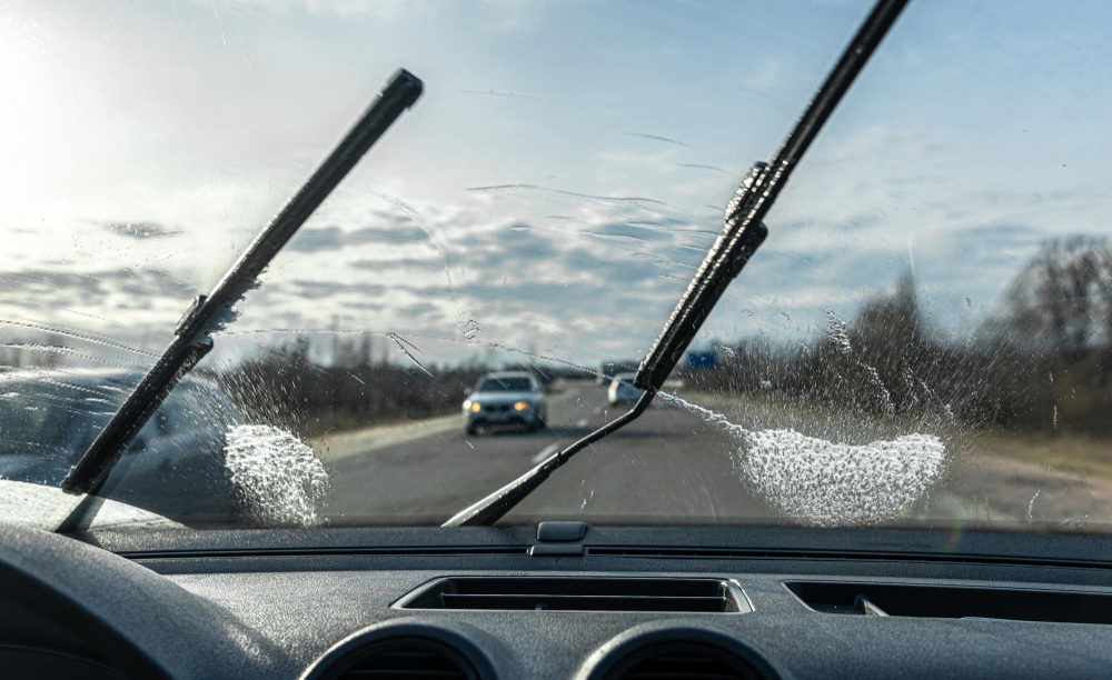 car-wipers-clean-windshields-when-driving-sunny-weather