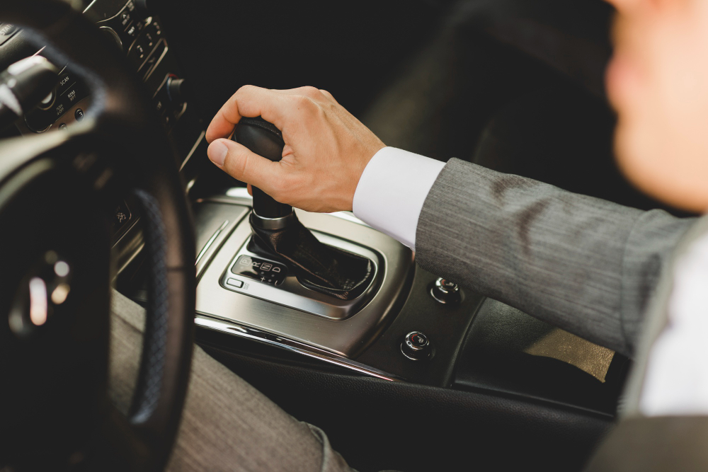 elevated-view-businessman-driving-car-moving-transmission-shift-gear