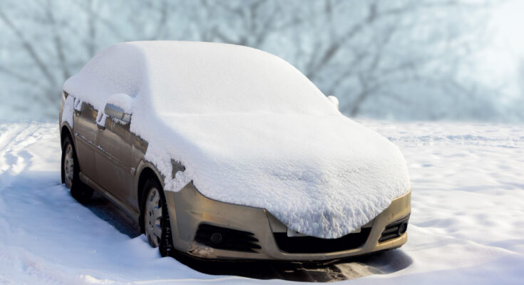 Snow Covered Car During Blizzard