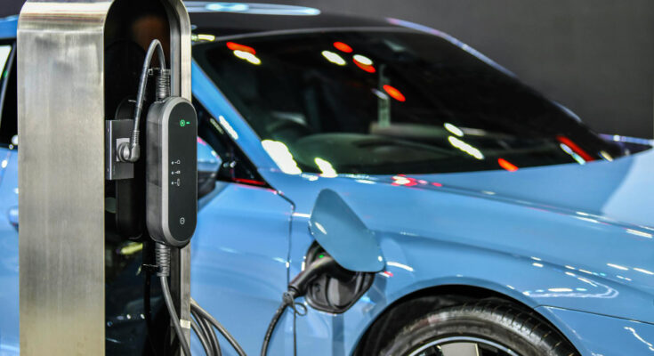 electric-vehicle-charging-station-with-power-supply-plugged-into-electric-car