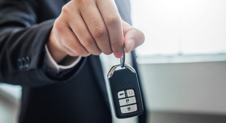sale-agent-giving-car-key-customer-sign-agreement-contract-insurance-car